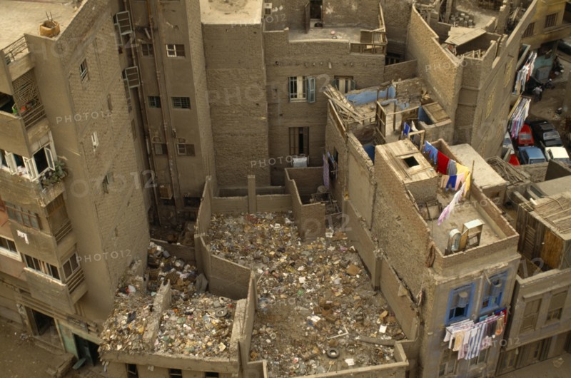 Environment, Litter, Aerial view looking down on building rooftops covered in rubbish in Cairo, Egypt.