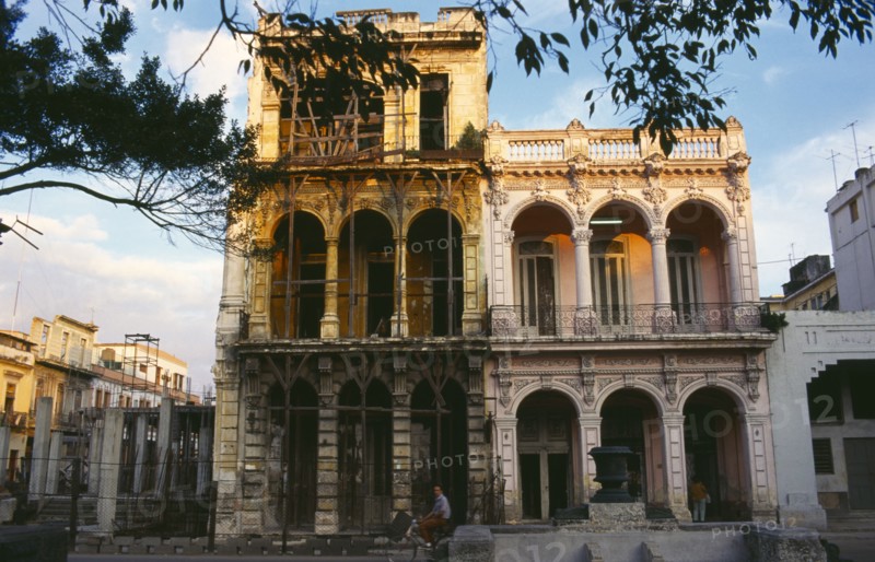CUBA, Havana, Old Havana, Prado district building facades in various states of disrepair.