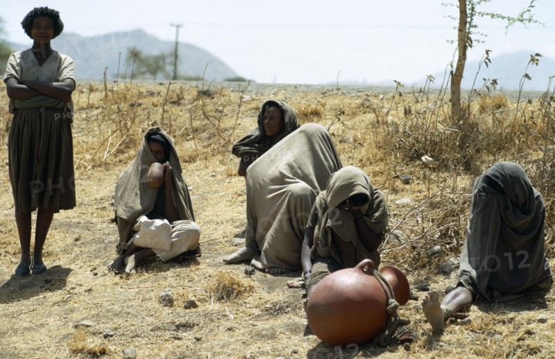 Ethiopia, Drought, Famine victims on parched land.