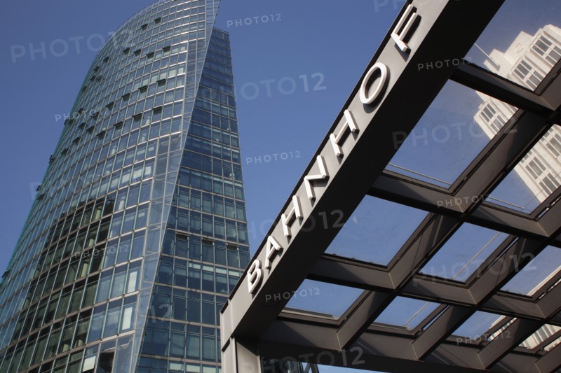 Germany, Berlin, Bahnhof station sign & office building at Potsdamer Platz.