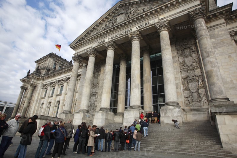Germany, Berlin, visitors queueing at entrance to the Reichstag.