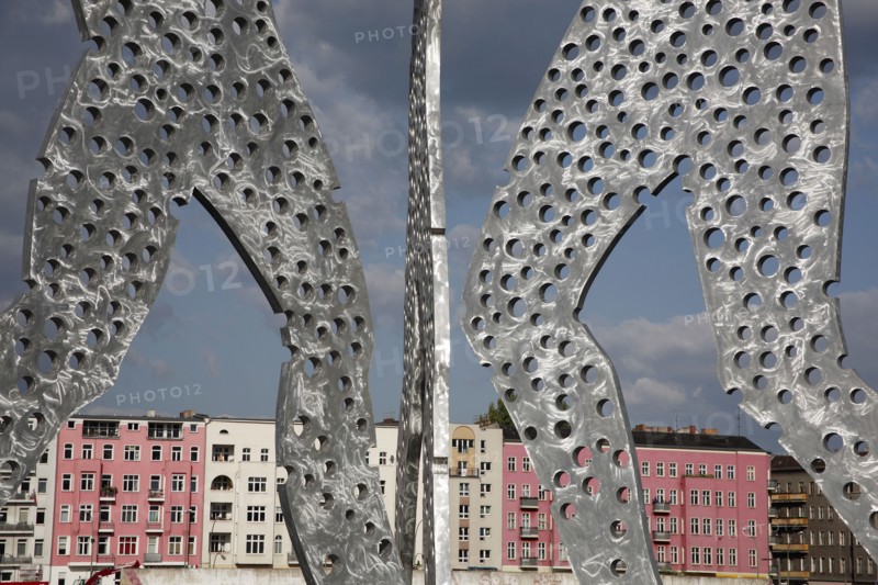 Germany, Berlin, Detail of Molecule Men sculpture 30 metres in height by Jonathan Borofsky on River Spree.