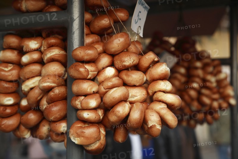 Poland, Krakow, Bread rolls for sale from street vendor's stall.