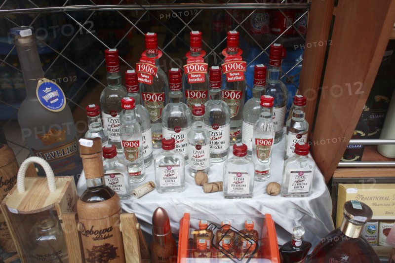 Poland, Krakow, display of vodka in shop front.