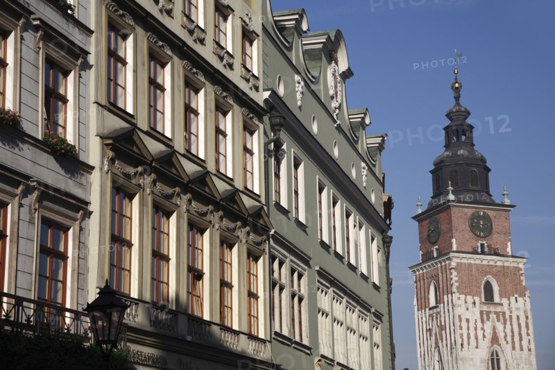 Poland, Krakow, Old Town Hall & pastel coloured buildings in the Rynek Glowny market square.