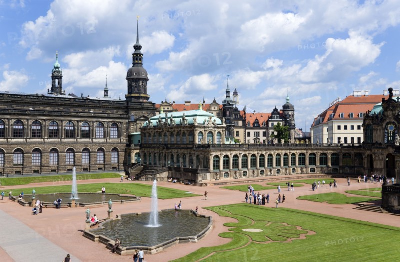 GERMANY, Saxony, Dresden, The central Courtyard of the restored Baroque Zwinger Palace gardens busy with tourists originally built between 1710 and 1732 after a design by Matthäus Daniel Pöppelmann in collaboration with sculptor Balthasar Permoser.
