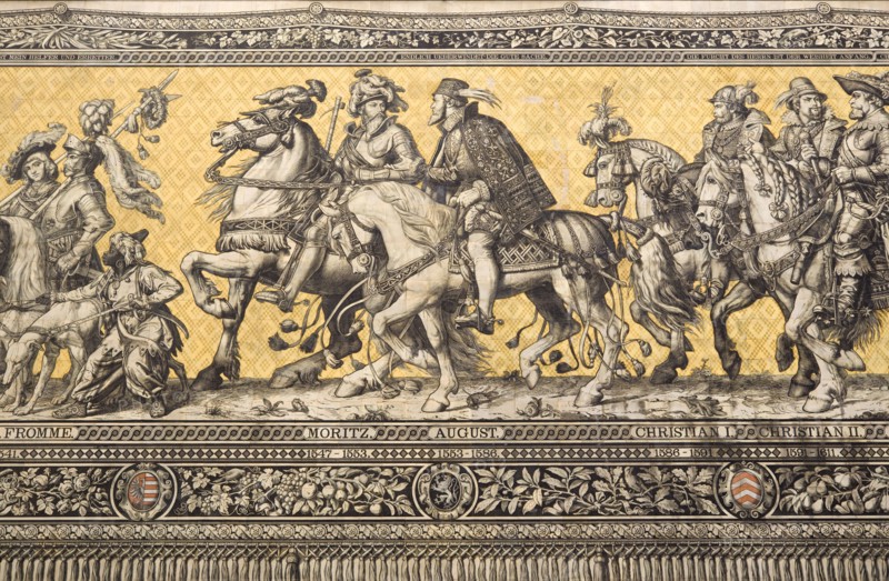 GERMANY, Saxony, Dresden, Fürstenzug or Procession of the Dukes in Auguststrasse a mural on 25,000 Meissen tiles that depicts 35 noblemen from the 12th century Konrad the Great, to Friedrich August III, Saxony's last king, who ruled from 1904-1918. It was originally painted by Wilhelm Walter between 1870 and 1876 but eventually, the stucco began to crumble and around 1906-07 it was replaced by the tiles. Detail showing Moritz and August.
