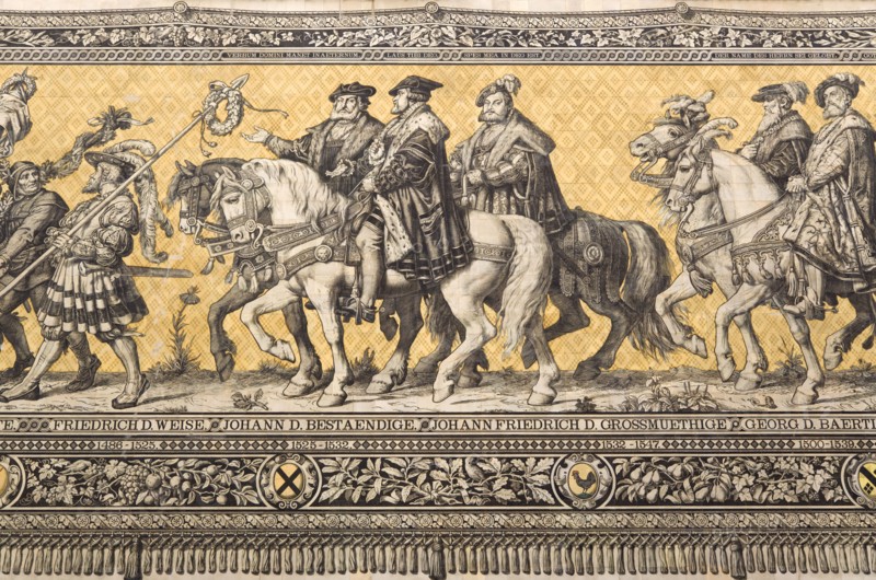 GERMANY, Saxony, Dresden, Fürstenzug or Procession of the Dukes in Auguststrasse a mural on 25,000 Meissen tiles that depicts 35 noblemen from the 12th century Konrad the Great, to Friedrich August III, Saxony's last king, who ruled from 1904-1918. It was originally painted by Wilhelm Walter between 1870 and 1876 but eventually, the stucco began to crumble and around 1906-07 it was replaced by the tiles.