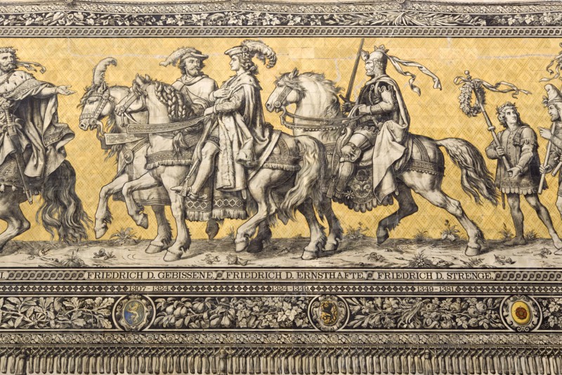 GERMANY, Saxony, Dresden, Fürstenzug or Procession of the Dukes in Auguststrasse a mural on 25,000 Meissen tiles that depicts 35 noblemen from the 12th century Konrad the Great, to Friedrich August III, Saxony's last king, who ruled from 1904-1918. It was originally painted by Wilhelm Walter between 1870 and 1876 but eventually, the stucco began to crumble and around 1906-07 it was replaced by the tiles.