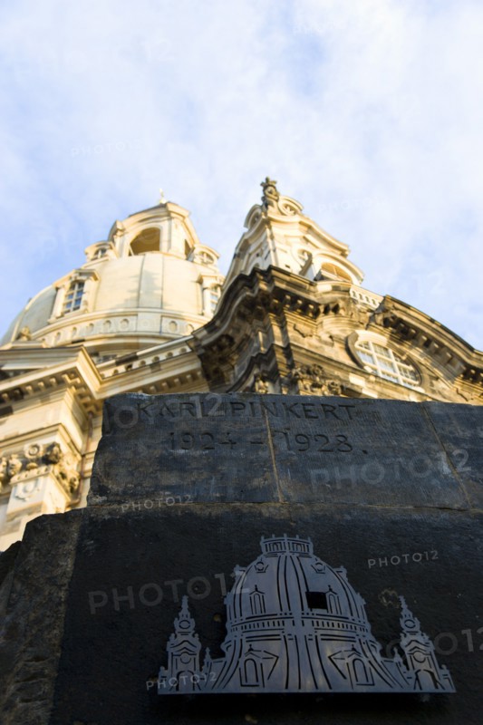 GERMANY, Saxony, Dresden, Detail in evening light of the Baroque Frauenkirche Church of Our Lady dome in Neumarkt square with the Karl Pinkert Stone in the foreground showing where it was the only remaining piece of the original dome.
