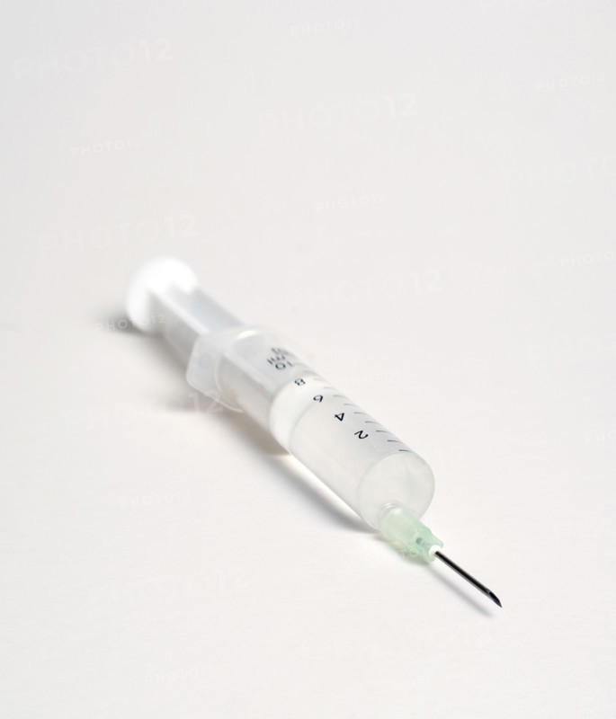 Health, Medicine, Medical Instruments, Hypodermic syringe with needle on a white background.