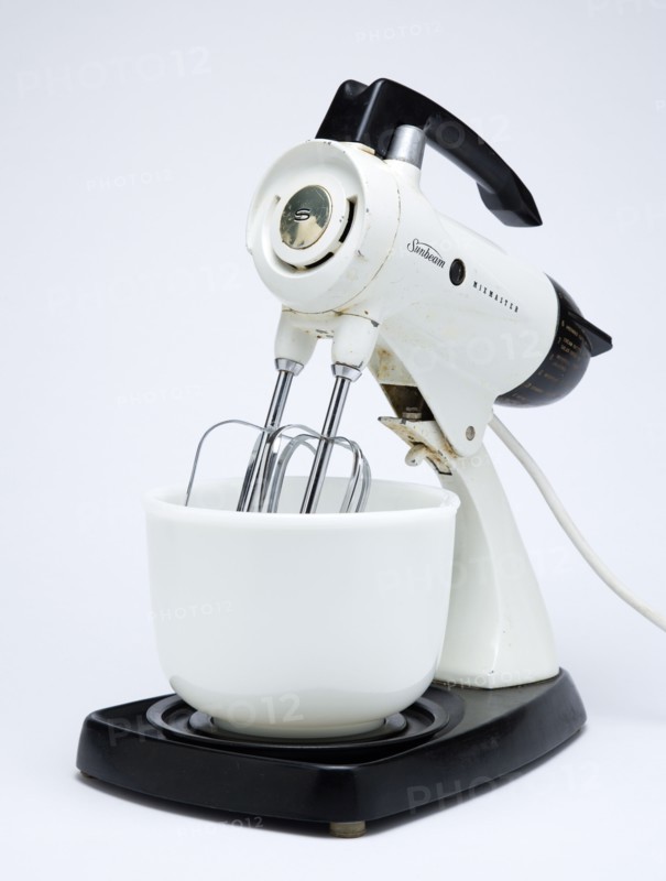 Food Preparation, Cooking, Kitchen Equipment, Sunbeam Mixmaster electric food blender or mixer circa 1953 on a white background.