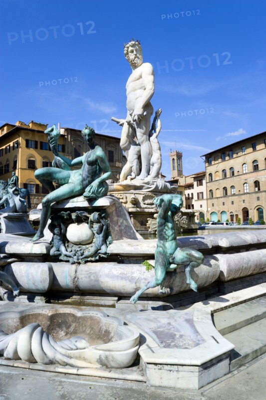 ITALY, Tuscany, Florence, The 1575 Mannerist Neptune fountain with the Roman sea God surrounded by water nymphs commemorating Tuscan naval victories by Ammannatti in the Piazza della Signoria beside the Palazzo Vecchio.