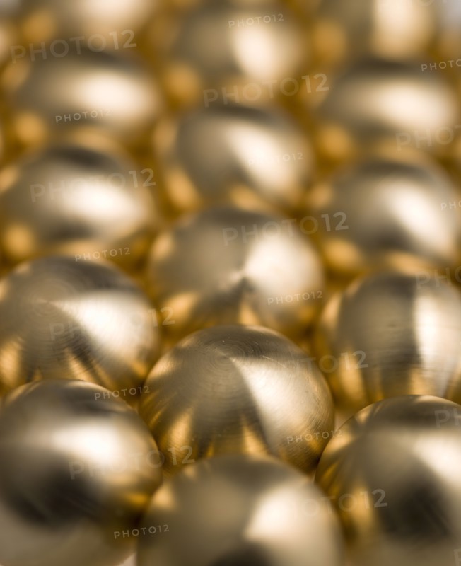 Industry, Machinery, Components, Brass metal lathe turned ball bearings.