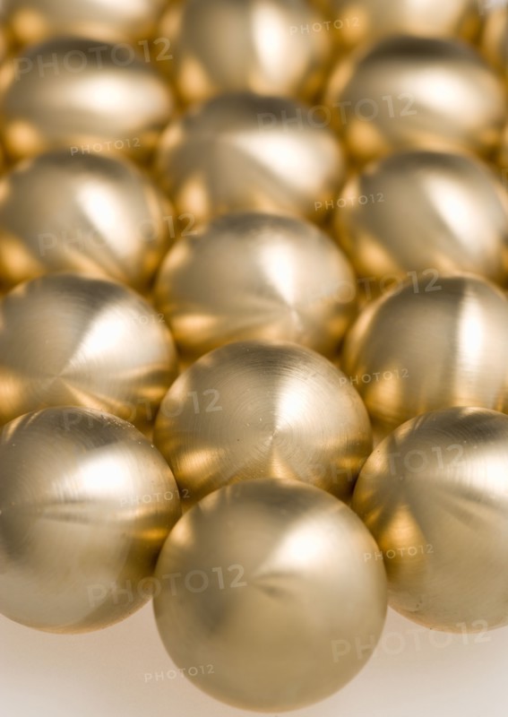 Industry, Machinery, Components, Brass metal lathe turned ball bearings.