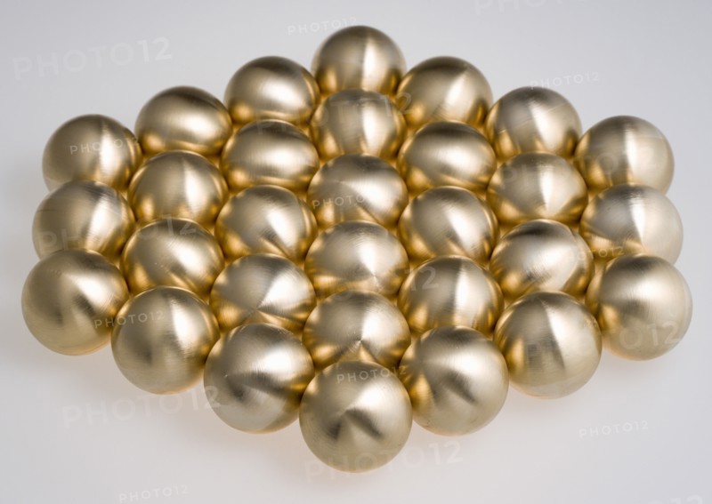 Industry, Machinery, Components, Brass metal lathe turned ball bearings arranged in a hexagon shape on a white background.