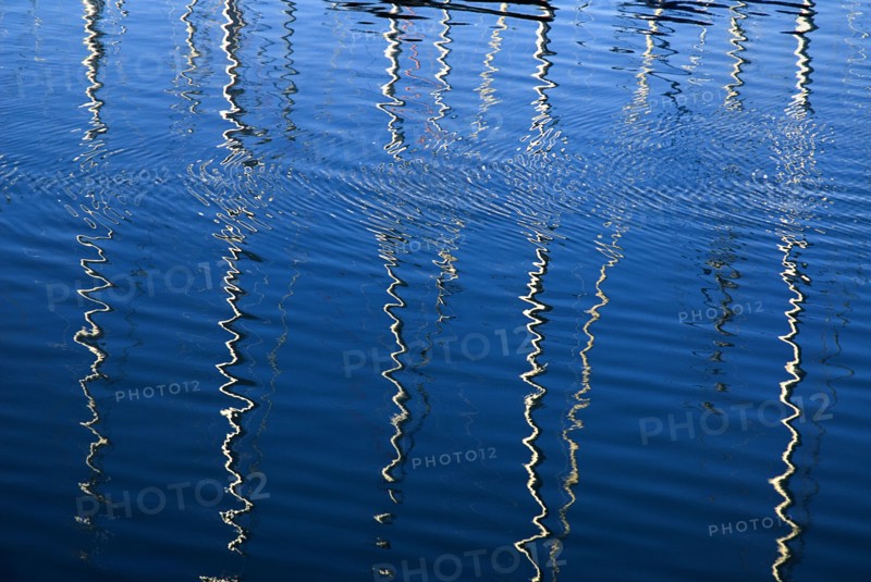 IRELAND, County Dublin, Howth Harbour, Reflection of yachts in the water.