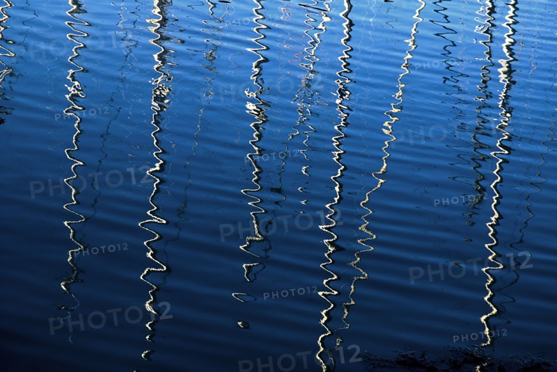 IRELAND, County Dublin, Howth Harbour, Reflection of yachts in the water.