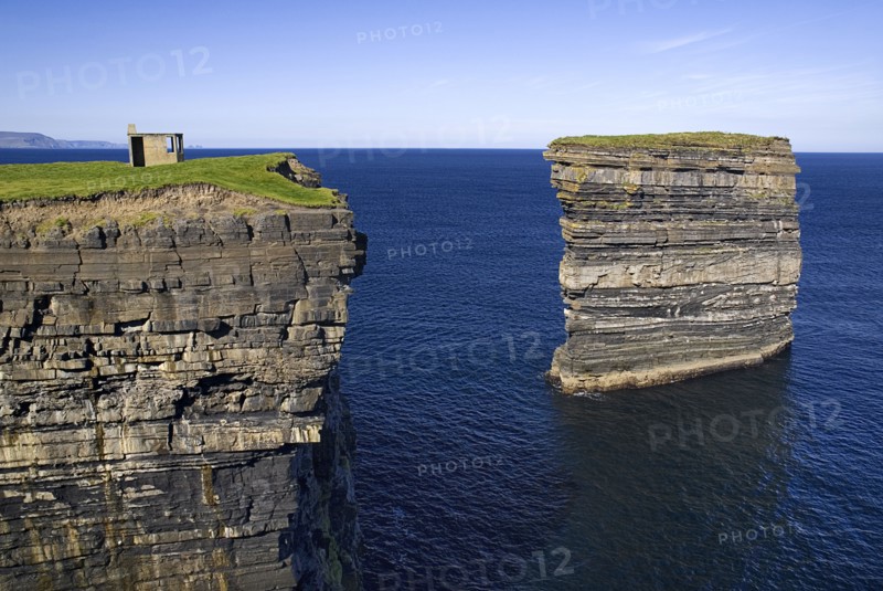 IRELAND, County Mayo, Downpatrick Head, Dún Briste Broken Fort is an impressive sea stack at the headland Standing 50 meters 164 feet high, Dún Briste was once part of the mainland, and connected to it by a sea arch.