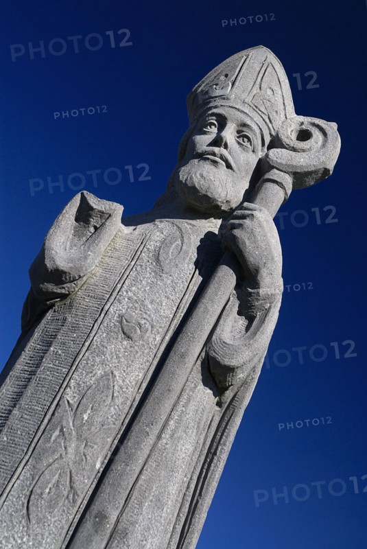 IRELAND, County Mayo, Downpatrick Head, Statue of St Patrick, who prayed frequently in the church.