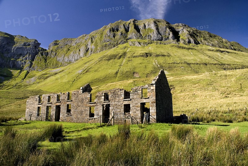IRELAND, County Sligo, Gleniff, Gleniff Horseshoe, ruin which was formerly a school for minerís children  Ben Bulben in background.