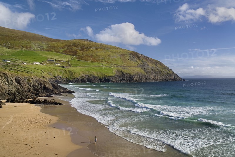 IREland, County Kerry, Dingle Peninsula, Coumeenole Beach at Slea Head  Figure on beach with incoming waves.