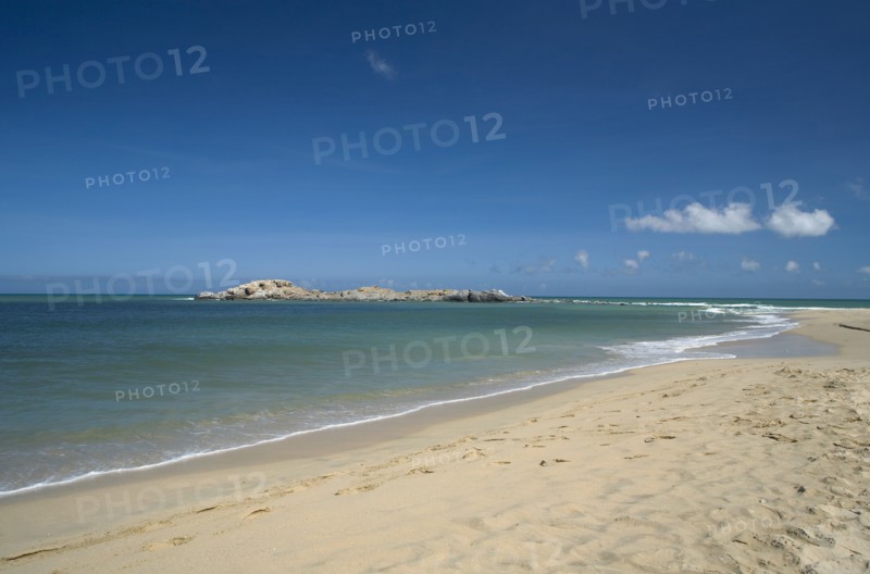 VENEZUELA, Margarita Island, Playa Caribe, View of exotic beach with its tropical crystal clear seawaters shoot on a bright day with blue sky and white clouds.