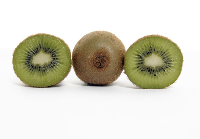 FOOD, Fruit, Kiwifruit, Whole and section through kiwi showing seeds and flesh.