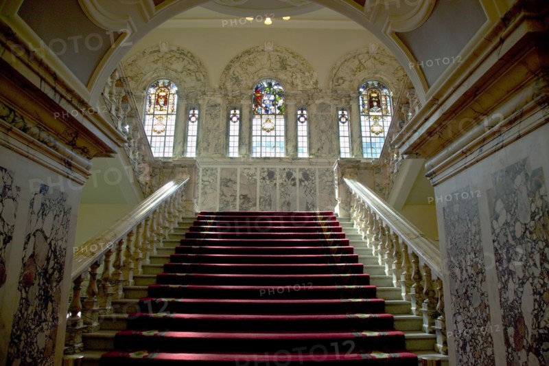 Ireland, North, Belfast, City Hall, Interior with stairs leading up past stained glass windows.