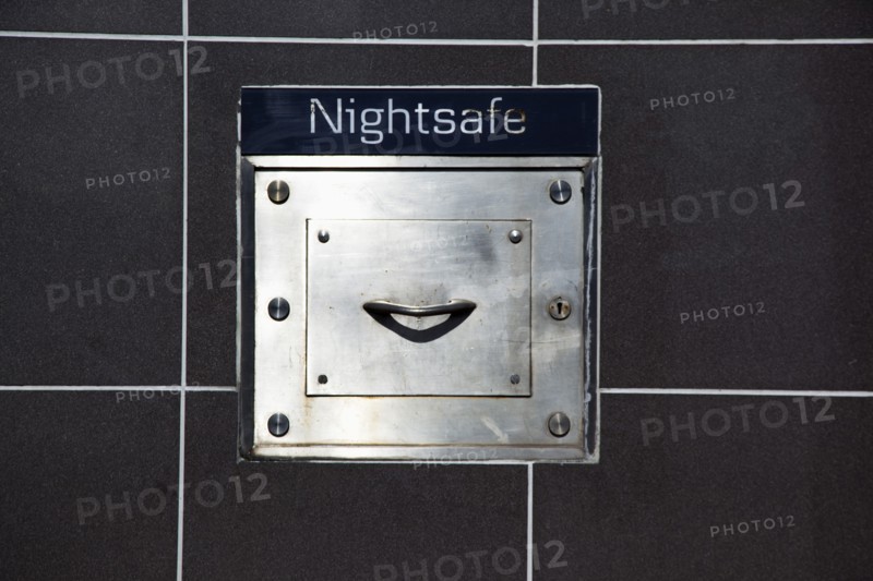 Ireland, North, Belfast, Andersonstown, Detail of Nightsafe drawer on on wall of Northern Bank.