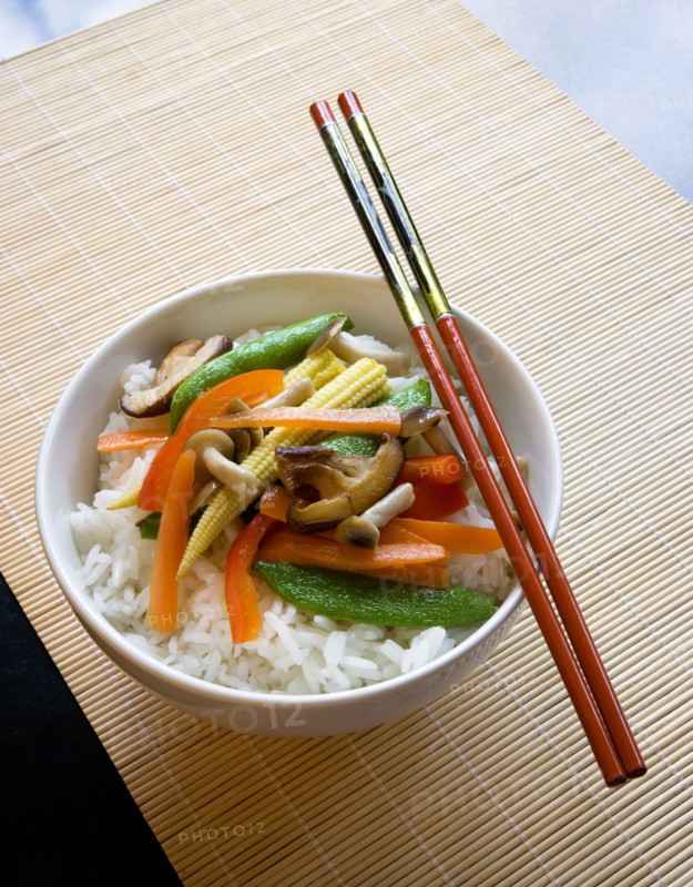 Food, Cooked, Vegetables, Stir fried vegetables and plain boiled rice in a bowl with chopsticks sitting on a bamboo table mat.
