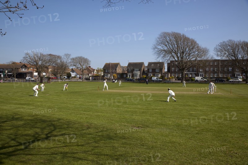 England, West Sussex, Southwick, Local Cricket team playing on village green.