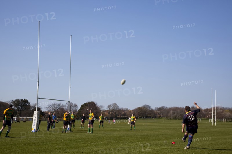 England, West Sussex, Shoreham-by-Sea, Rugby Teams playing on Victoria Park playing fields. Player kicking a conversionbetween the posts.