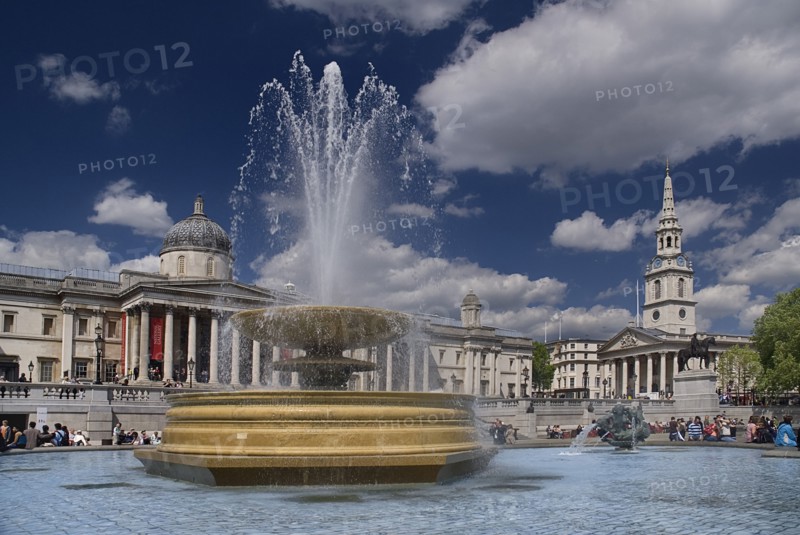 England, London, Trafalgar Square, Fountan with the National Gallery behind.