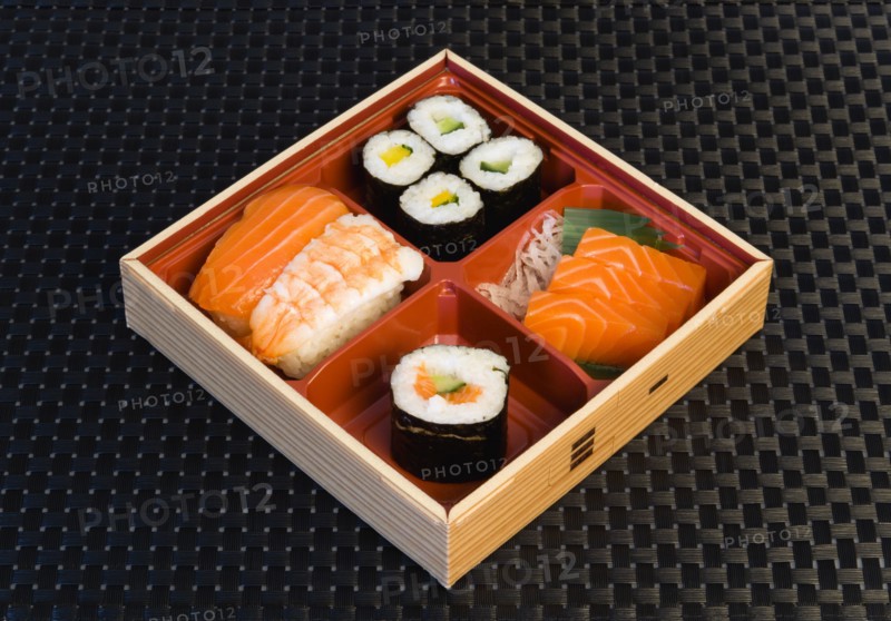 Food, Meal, Sushi, Bamboo box with sushi rice wrapped in seaweed and seafood and fish selection.