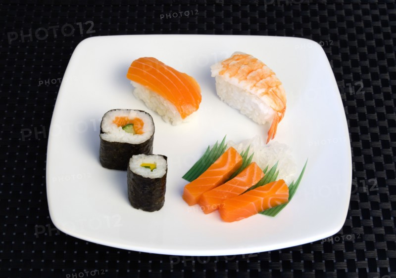 Food; Sushi; Meal; Sushi plate with rice wrapped in seaweed and seafood and fish selection.