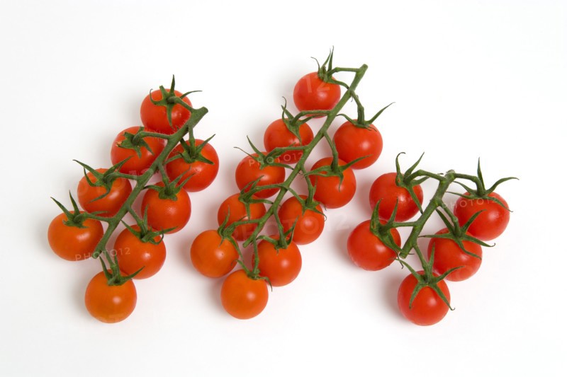Food, Fruit, Tomato, Ripe red cherry tomatoes on the vine against a white background.