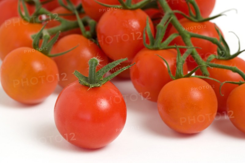 Food, Fruit, Tomato, Ripe red cherry tomatoes on the vine against a white background.