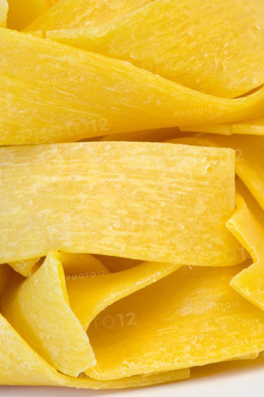 Food, Uncooked, Pasta, Ribbons of durum wheat Pappardelle against a white background.
