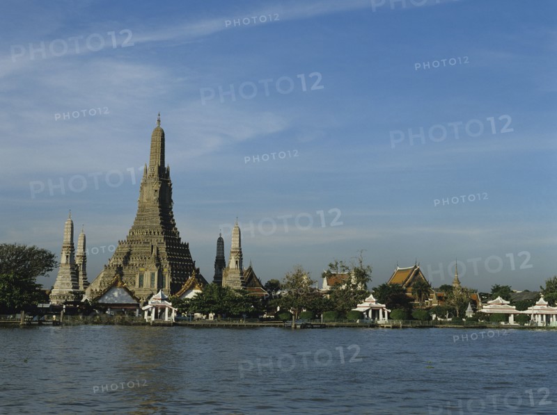 Thailand, Bangkok, view across the Chao Praya river toward Wat Arun temple of the Dawn.