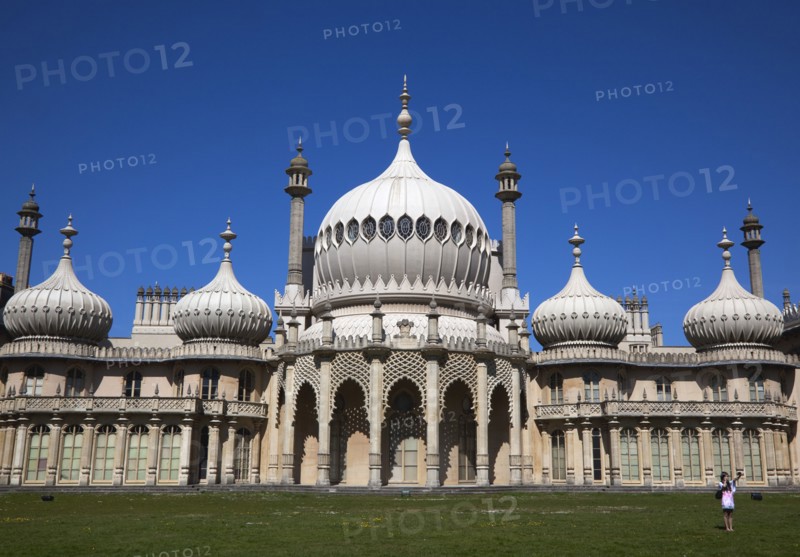 England, East Sussex, Brighton, The Royal Pavilion, 19th century retreat for the then Prince Regent, Designed by John Nash in a Indo Sarascenic style, tourist photographing herself and onion domes.