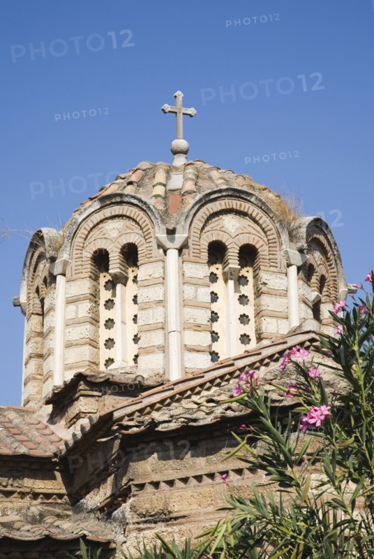 Athens, Attica, Greece. The Church of the Holy Apostles also known as Holy Apostles of Solaki located in the Ancient Agora of Athens and can be dated to around the late tenth century. Part view of extrior and domed tiled roof with cross at centre. Greece Greek Attica Athens Europe European Vacation Holiday Holidays Travel Destination Tourism Ellas Hellenic Church Holy Apostles Solaki Agora Ancient Religion Religious Christian Christianity Exterior Atenas Athenes Blue Center Destination Destinations Ellada History Historic Religion Religious Christianity Christians Southern Europe