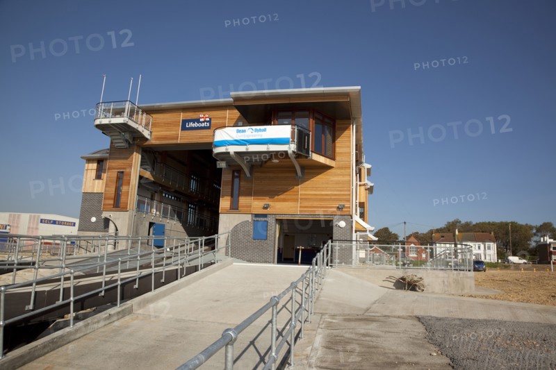 Shoreham-by-Sea, West Sussex, England. Kingston Beach Newly constructed lifeboat house opposite the harbour entrance. England English West Sussex County Shoreham Shoreham-by-Sea by Sea Water Kingston Beach Europe European Architecture Modern Life Boat Lifeboat Lifeboats RNLI Wood Wooden Clad Galvanised Metal Zinc Blue Sky Station Home Timber Frame