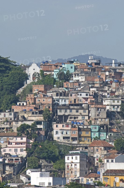Rio de Janeiro, Brazil. Favela or slum housing above Saude neighbourhood some with traditional tile roofs very steep hill roads greenery and Church. Brazil Brasil Brazilian Brasilian South America Latin Latino American City Urban Architecture Houses Housing Homes Neighbourhood Neighborhood Saude Slums Slum Slum Favela Classic Classical Destination Destinations Historical Latin America Older Shanty South America Southern