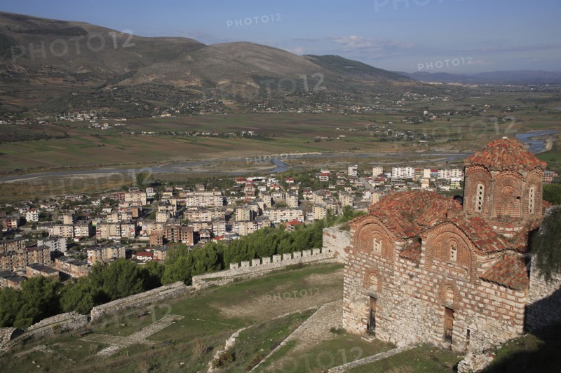 Berat, Albania. St Triada Church on the right with Berat new town beside the River Osum in the background. Albanian Shqip‘ria Southern Europe Albania Albanian Republic Europe European Travel Destination Indo European Berat River Osum Town Church St Saint Triada Church Christian Christianity Byzantine Religion Religious Landscape Floodplain Destination Destinations Religion Religious Christianity Christians Scenic