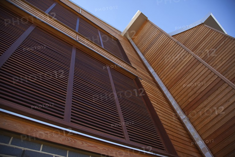 Shoreham-by-Sea, West Sussex, England. Kingston Beach Newly constructed lifeboat house opposite the harbour entrance. England English West Sussex County Shoreham Shoreham-by-Sea by Sea Water Kingston Beach Europe European Architecture Modern Life Boat Lifeboat Lifeboats RNLI Wood Wooden Clad Galvanised Metal Zinc Blue Sky Station Home Timber Frame