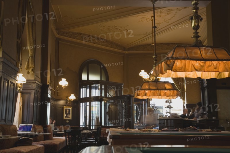 Vienna, Austria. Mariahilf District Cafe Sperl the preferred cafe of Adolf Hitler. Interior with young woman using laptop in window alcove. Established for over 120 years the Cafe Sperl offers billiards and forbids mobile phones. Austria Austrian Vienna Viennese Wien Mariahlf 6th District Cafe Sperl Hitler Waitress Interior Coffee Europe European Work Urban City Table Tables Billiard Billiards Bar Bistro Cell Cellular Destination Destinations Female Women Girl Lady History Historic Immature One individual Solo Lone Solitary Osterreich Restaurant Viena Western Europe