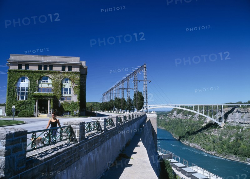 Niagara, Ontario, Canada. Hydro Electric Power Station and bridge to the United States. HEP American Blue Canadian Destination Destinations Ecology Entorno Environmental Environnement Green Issues Holidaymakers North America Northern One individual Solo Lone Solitary Tourism Tourist