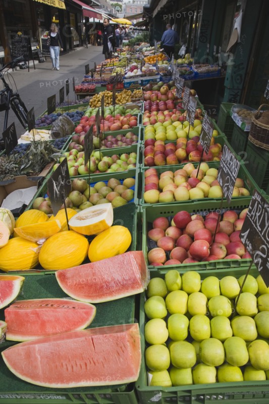 Vienna, Austria. The Naschmarkt. Display of melon and apples for sale on fresh fruit stall in market. Austria Austrian Republic Vienna Viennese Wien Europe European City Capital Naschmarkt Market Display Fresh Food Fruit Stall Shop Store Destination Destinations Osterreich Viena Western Europe