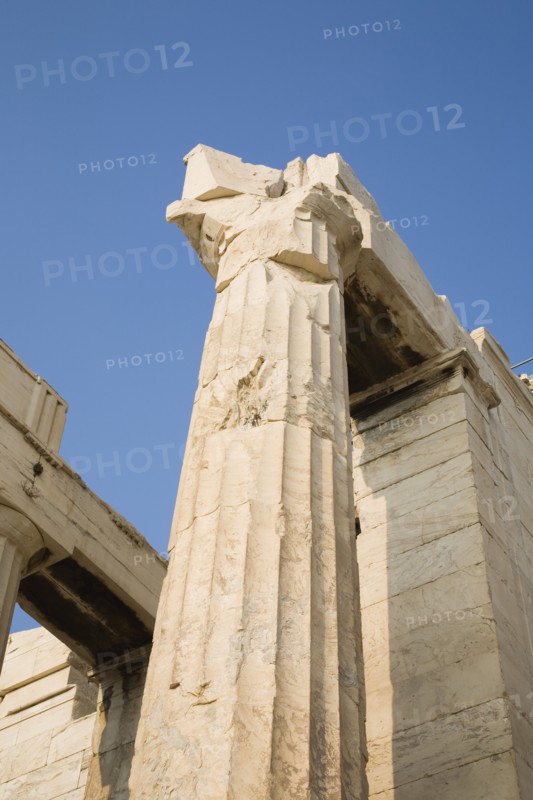 Athens, Attica, Greece. Acropolis Propylaea gate against clear blue summer sky from low viewpoint looking upwards. Greece Greek Europe European Vacation Holiday Holidays Travel Destination Tourism Ellas Hellenic Athens Attica Acropolis Propylaea View Architecture Ruin Ruins Column Columns Blue Sky Atenas Athenes Destination Destinations Ellada History Historic Southern Europe
